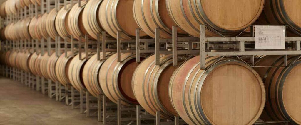 Learning how to import liquor means learning about equipment such as the aging barrels displayed in this picture.