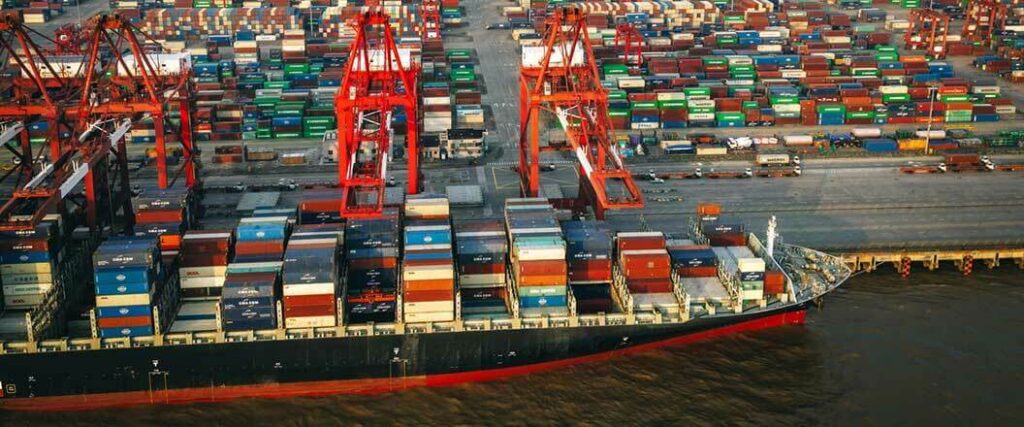 A cargo ship in the process of being loaded