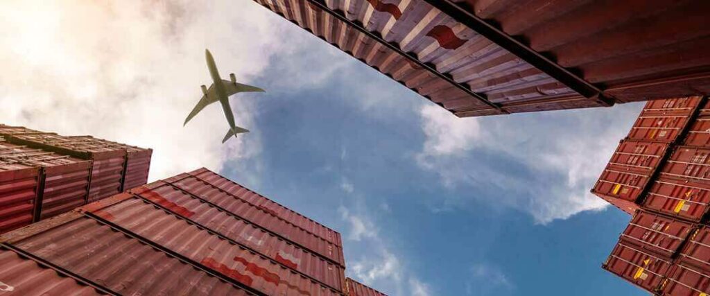 A single entry bond is required to import goods such as the ones stored in cargo containers displayed in this image.