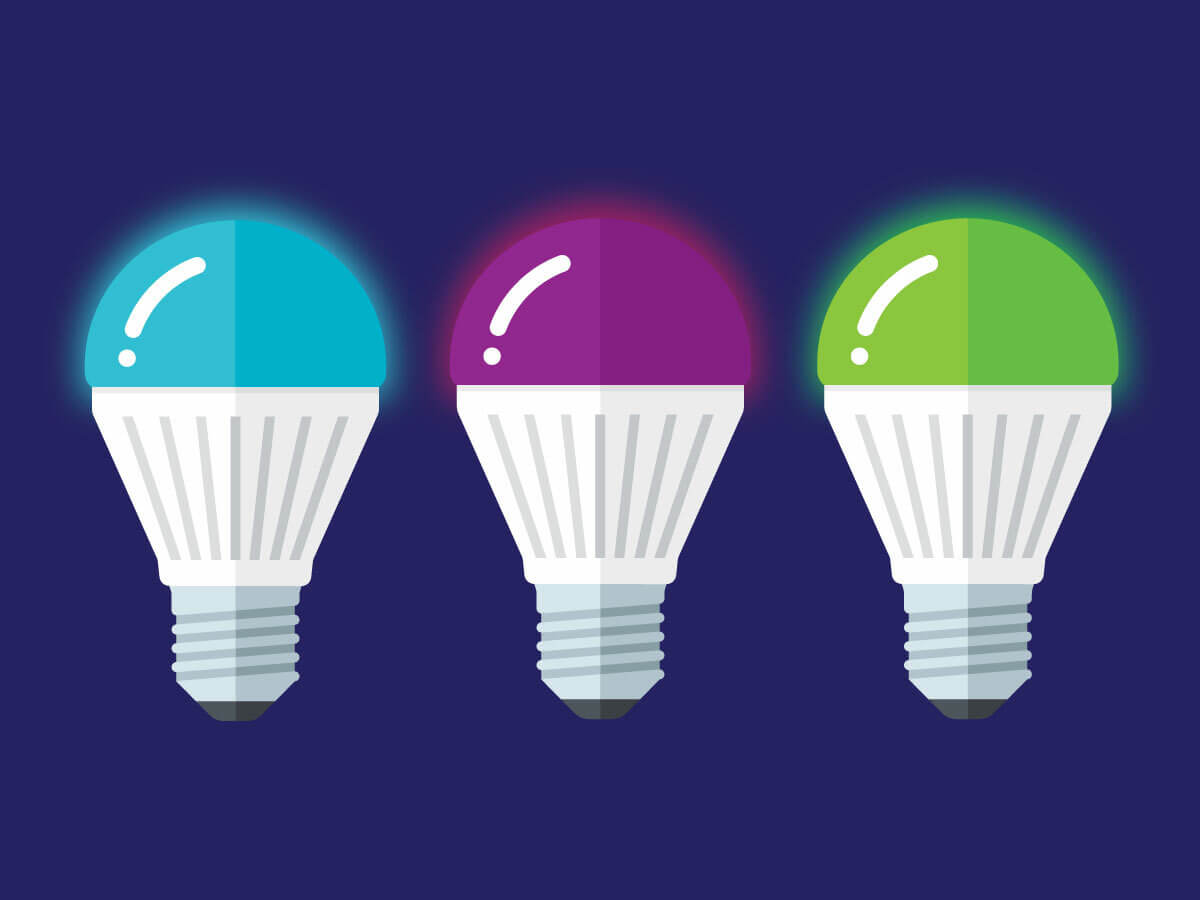 A digital image depicting three LED light bulbs in three distinct colors: blue, purple, and green on a dark purple background.