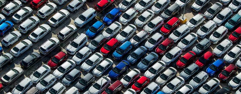 Aerial view of cars parked close to one another