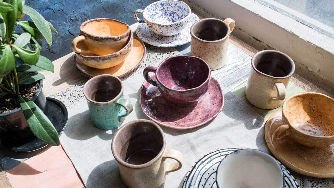 Ceramic cups and plates laying on a table