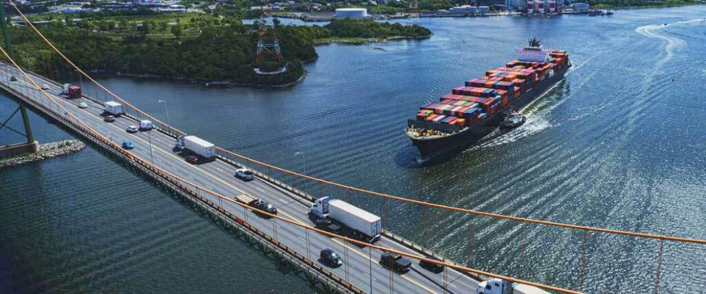 Container ship about to cross under a bridge. 