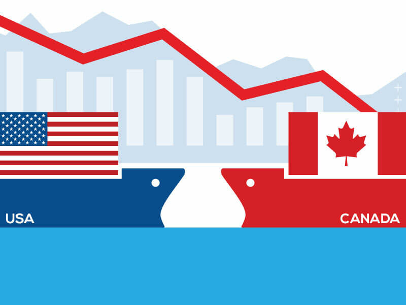 Two cargo ships, one with the American flag and the other with the Canadian flag.