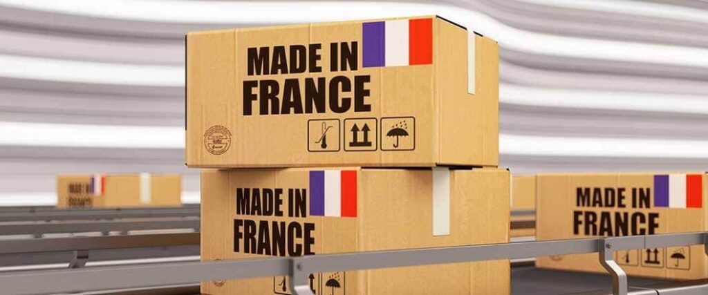 Boxes labeled "Made in France" on a conveyor belt in a warehouse.