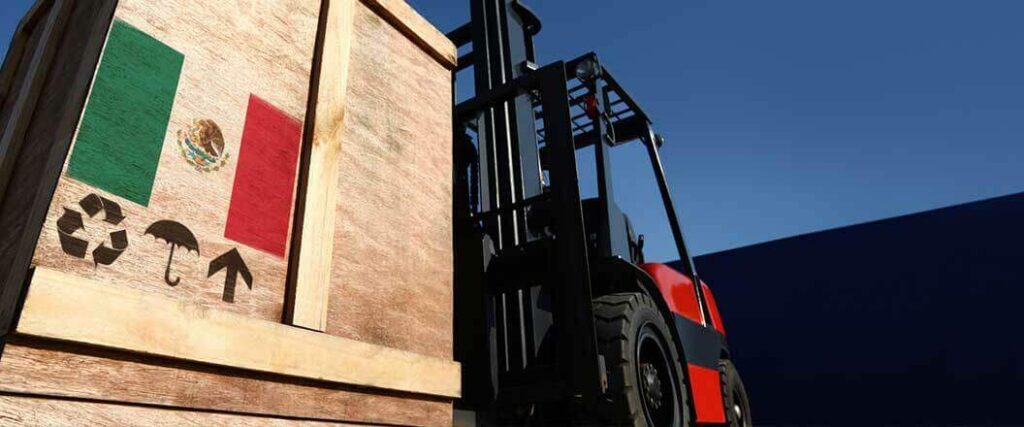 A palletized crate with the Mexican flag that's lifted by a forklift