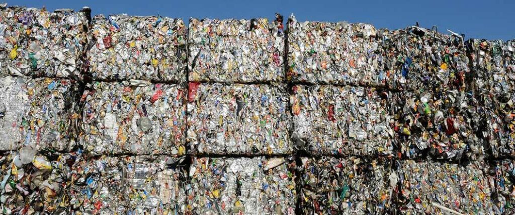 Baled and cubed segments of scrap metal.