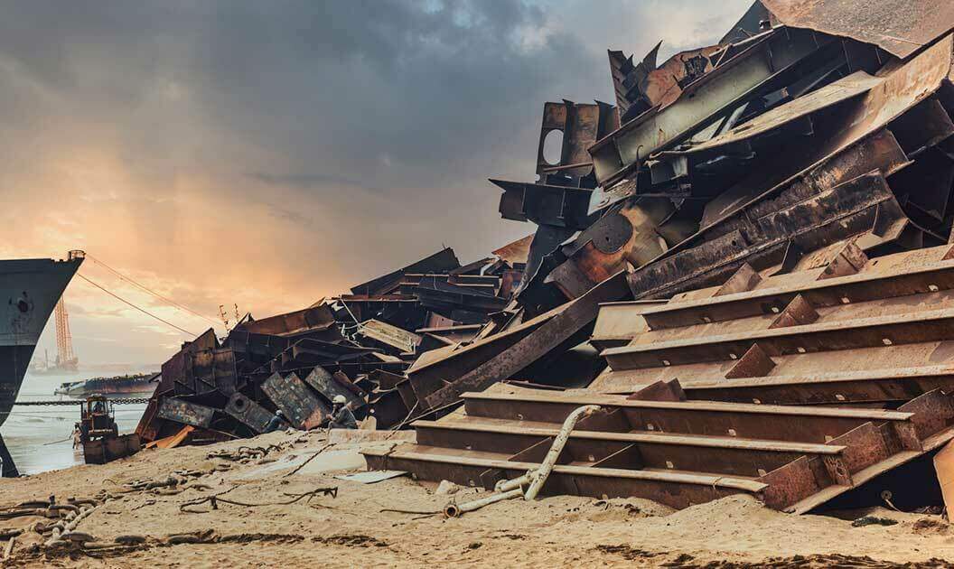 Scrap metal accumulated on a shore.