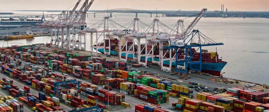 Container ship being loaded before departure. 