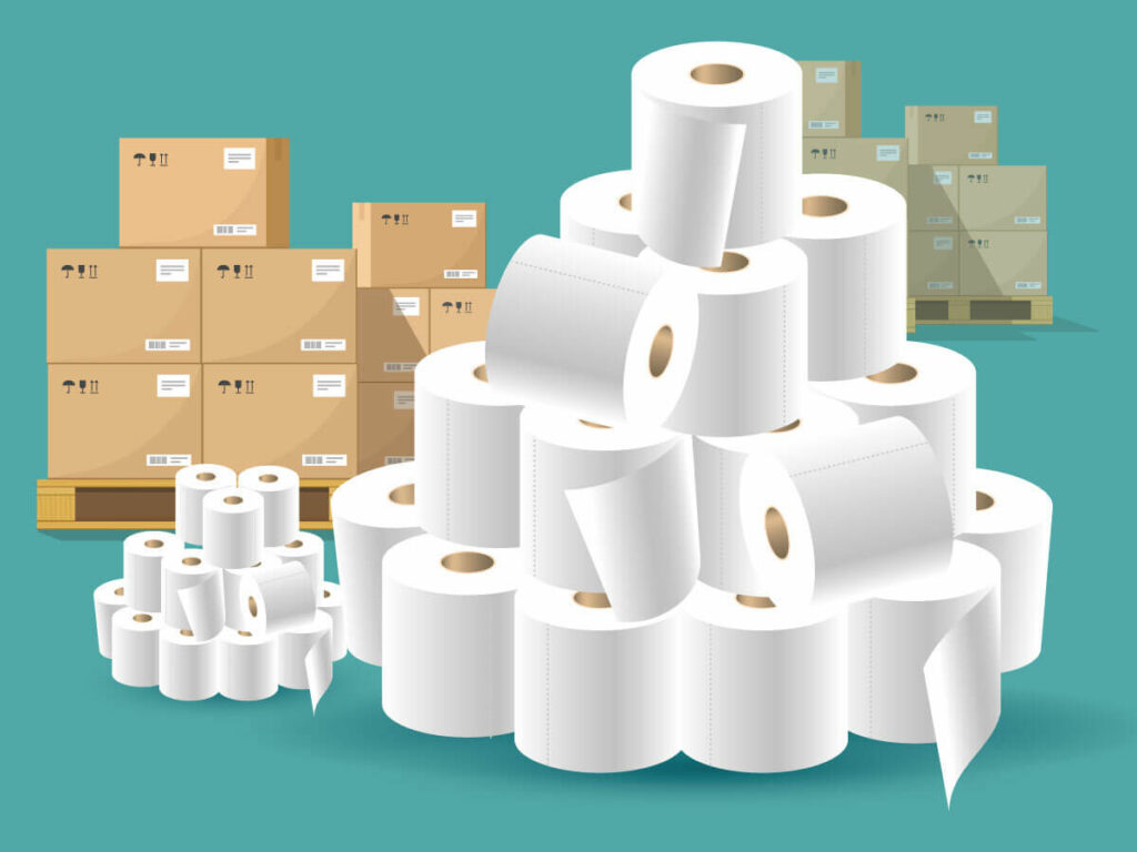 Stacks of toilet paper and a cardboard boxes