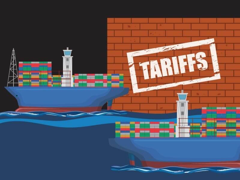 A stylized digital image depicting a cargo vessel attempting to dock at port, but being blocked by a large brick wall, upon which the word "TARRIFS" has been stamped.